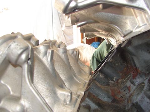 1992 Ford Taurus - Engine intake manifold and block detail, with a person working in the background.