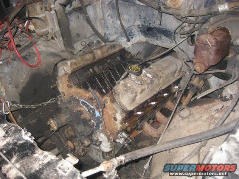 1985 Ford Bronco - Close-up view of a V8 engine compartment, showing various mechanical components and wiring.