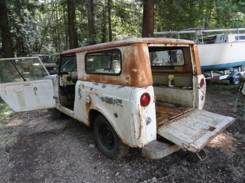 1962 International Scout 80 - This 1962 International Scout 80 is seen in a wooded area with its doors open.
