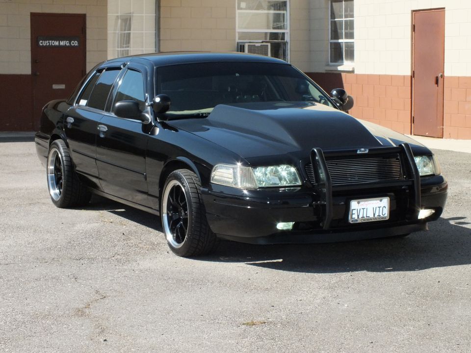 Black Ford Crown Victoria front three-quarter with brush guard and EVIL VIC plate