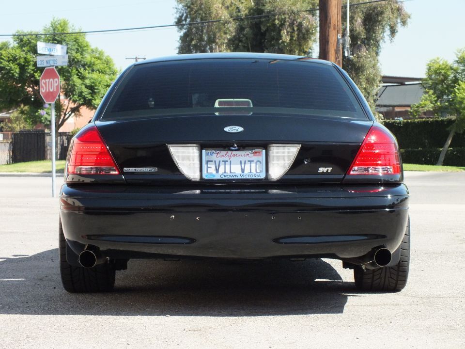 Black Ford Crown Victoria rear, California EVIL VIC plate with CROWN VICTORIA frame, SVT badge