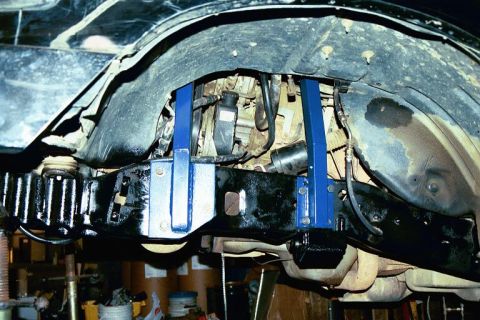 1994 Ford Bronco - Close-up of the undercarriage, highlighting suspension components and frame structure.