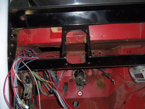 1968 Ford Bronco - A complex wiring harness is visible in the firewall area of a vehicle's dashboard.