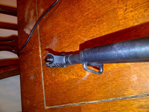 1989 Ford Bronco - Close-up of an SKS rifle's front sight and gas block assembly.