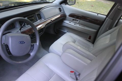 2005 Ford Crown Victoria - added 2005 LX seats and door panels. $355 for all that. The seats are heated, wired up and working. Just rolled 103500 miles in 2012.