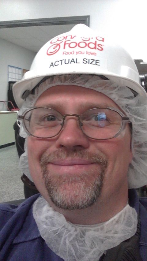 1989 Ford Bronco - Man wearing a Con-Agra Foods hard hat and hair net smiles for the camera.
