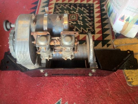 2000 Jeep Wrangler - This is a winch assembly with two carburetors, likely for an engine, shown on a rug.