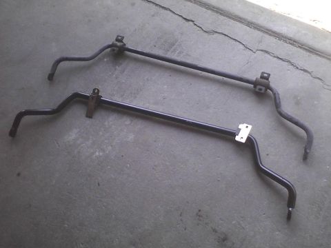 2003 Ford Crown Victoria - Two sway bars are shown on a concrete surface. The registry claims they are from a 2003 Ford Crown Victoria, but this cannot be confirmed f…