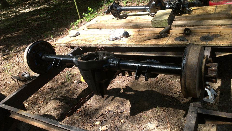 Ford Bronco rear axle assembly on wooden planks outdoors