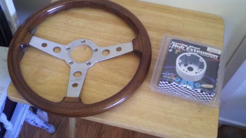 1978 Ford Bronco - Aftermarket wooden steering wheel and a 2" hub extension kit are shown on a table.