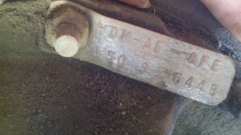 1978 Ford Bronco - A metal identification tag with stamped alphanumeric characters is shown in detail.