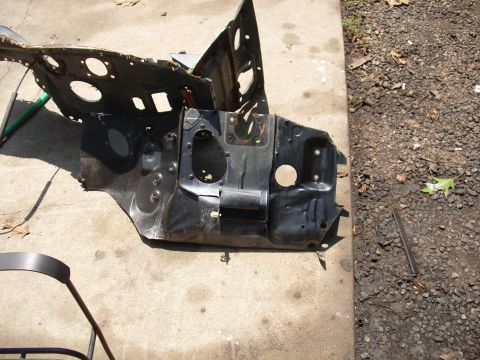 1988 Ford Bronco - This is a damaged firewall section, likely removed for replacement, with various holes and mounting brackets visible.