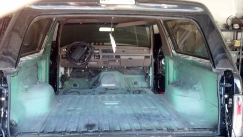 1995 Ford Bronco - Interior view of a 1995 Ford Bronco stripped down for work.