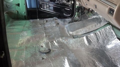 1995 Ford Bronco - Sound deadening material installed on the floor of a vehicle's interior.