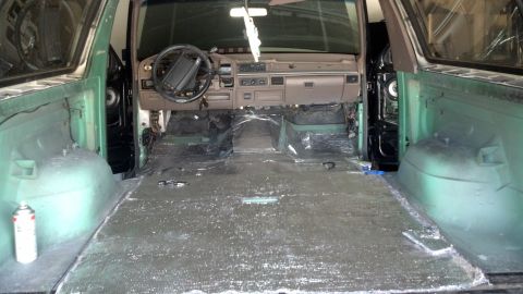 1995 Ford Bronco - The interior of the vehicle is being worked on, with the floor stripped bare.