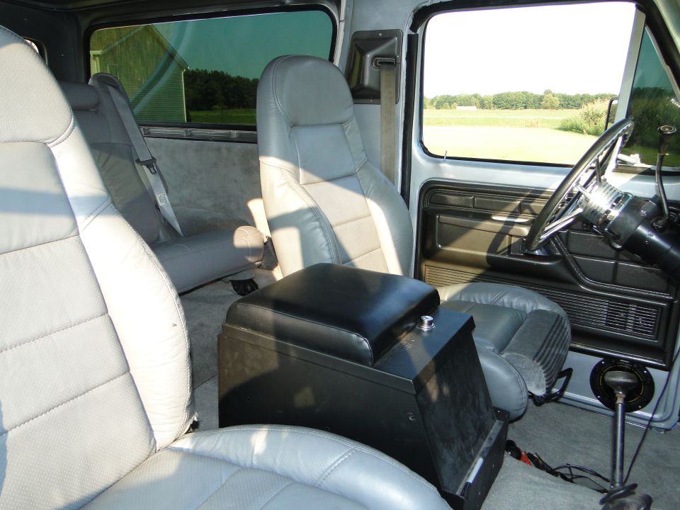 1978 Ford Bronco interior with grey seats and black console