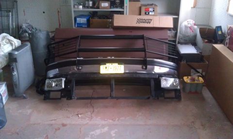 1993 Ford Bronco - Front bumper assembly with grille guard and license plate, likely for a truck or SUV.