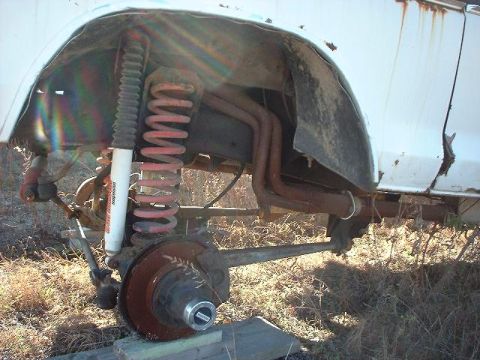 1993 Ford Bronco - Front suspension components of a Ford Bronco, showing rust and wear.
