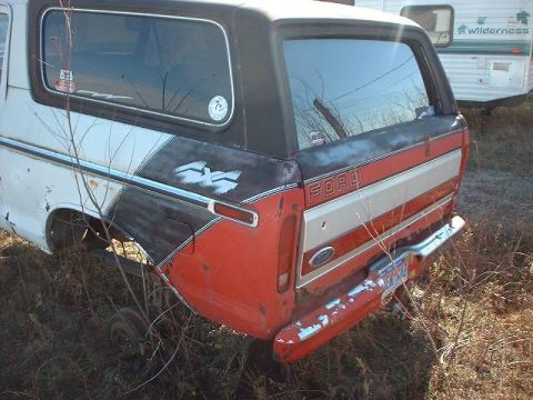 1993 Ford Bronco - This Ford Bronco features a distinctive two-tone paint scheme and 4x4 badging on the rear quarter panel.