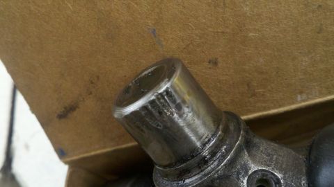 1978 Ford Bronco - Close-up of a worn metal component, likely a mechanical part from a vehicle.