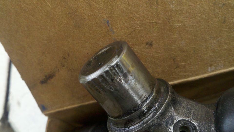 Metal part with visible wear marks and grease
