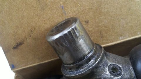 1978 Ford Bronco - A metal component with a splined end is shown in detail against a cardboard background.