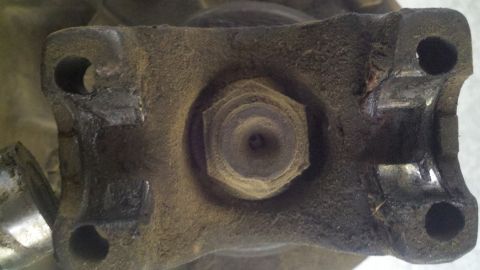 1978 Ford Bronco - A close-up view of a driveshaft U-joint flange, showing wear and rust.