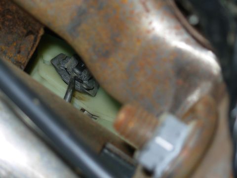 1997 Chevrolet Silverado 3500 - Using 2 long Craftsman picks, I was able to release the clip. I raised the brake switch off the rod & used it to push the clip off the pin.