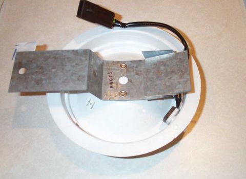 1998 Ford Crown Victoria - The standard P71 domelight. The longer end is the front. The hole is for a tab that goes up into the headliner to hold the dome light in pl…