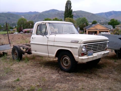 1967 Ford F-250 - This 1967 Ford F-250 pickup truck is missing its bed and is parked outdoors.