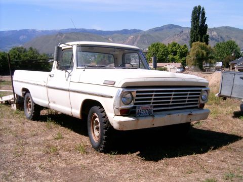 1967 Ford F-250 - White 1967 Ford F-250 pickup truck with a horizontal bar grille and round headlights.