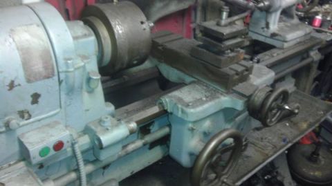 1989 Ford Bronco - A metal lathe is shown with its chuck and tool post, a common piece of industrial machinery.