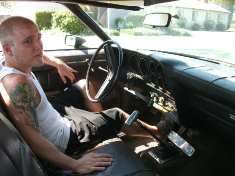 1972 Ford Ranchero - Interior view of a 1972 Ford Ranchero with a man in the driver's seat.