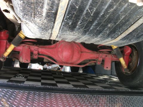 1972 Ford Ranchero - The rear differential and suspension components of a 1972 Ford Ranchero are visible from below.