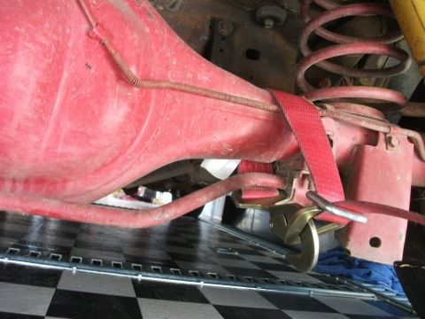 1972 Ford Ranchero - Rear axle and suspension components are visible, secured by a red strap.