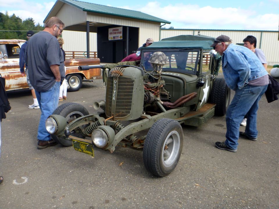 Old tractor with people gathered around it