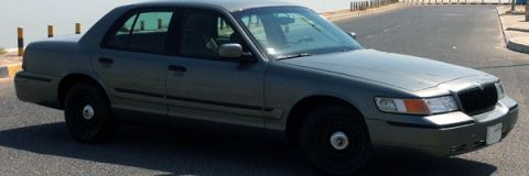 2001 Mercury Grand Marquis - This 2001 Mercury Grand Marquis sedan is captured from a 3q front angle on a paved road near the water.