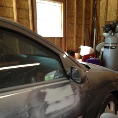 2007 Ford Mustang - A car door is shown with body filler, suggesting it is undergoing repair work.