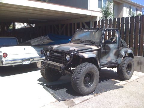 1987 Suzuki Samurai - This 1987 Suzuki Samurai is parked in a driveway, partially covered by a carport.