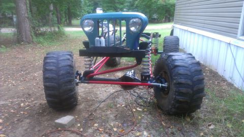 1978 Ford Bronco - This custom off-road vehicle chassis features oversized tires and a distinctive blue grille, suggesting a build focused on extreme terrain…
