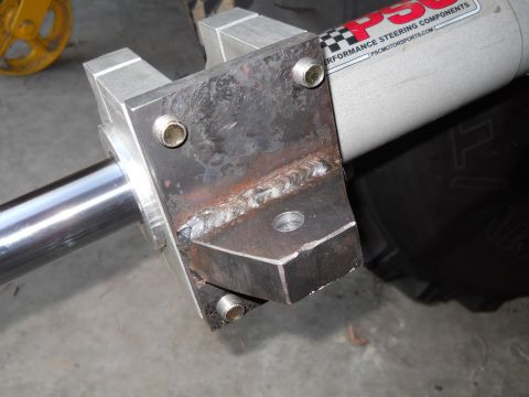1992 Ford Bronco - Close-up of a custom-mounted steering component, branded PSC Motorsports, with visible welding on the bracket.