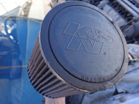 1993 Ford Taurus - Close-up of a K&N air filter, showing the brand logo and part number B045D6.