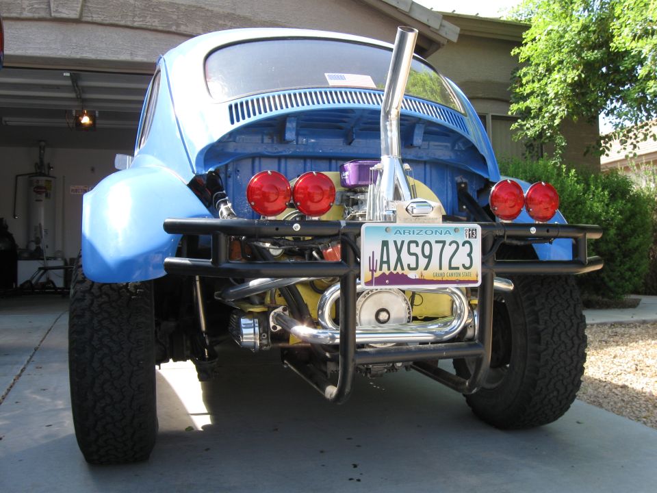Blue 1970 Volkswagen Beetle Baja Bug with custom rear bumper, exhaust, and lights. Arizona license plate AX59723