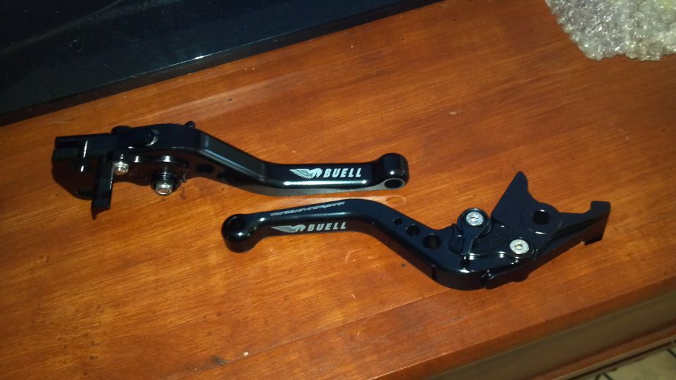 Black Buell motorcycle levers with logo