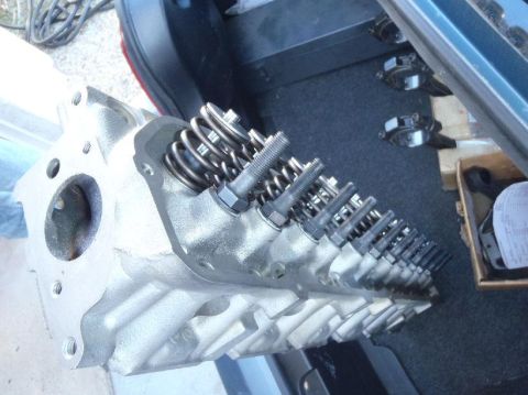 1978 Ford Bronco - Close-up view of an engine cylinder head, showing valve springs and studs.