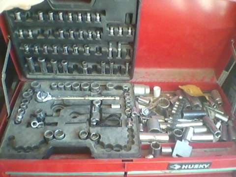 1996 Ford F-150 - Open red tool chest containing a large assortment of sockets and a ratchet wrench.