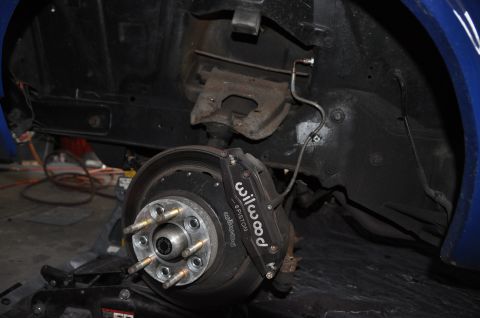 1971 Ford Mustang - Close-up of a vehicle's front suspension system, highlighting the brake components.
