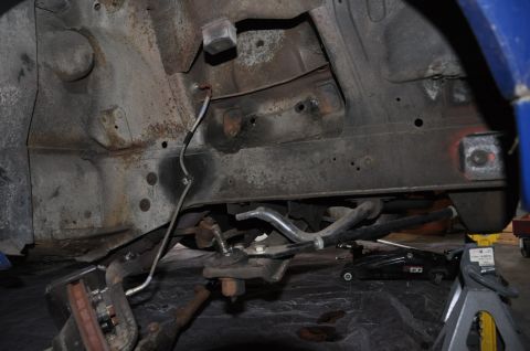 1971 Ford Mustang - Close-up view of the front suspension system of a 1971 Ford Mustang, highlighting its structural components.
