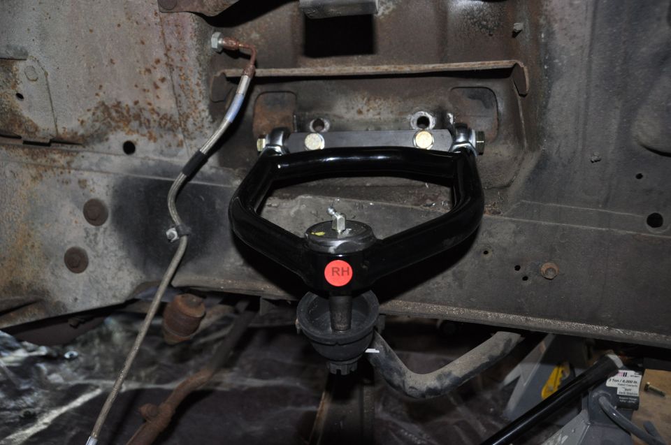 Black upper control arm with red RH badge, front suspension part