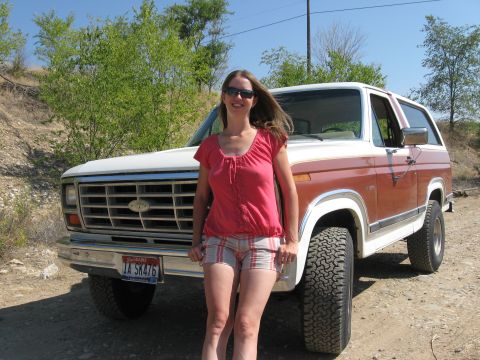 1981 Ford Bronco - A woman poses with a classic Ford Bronco, which appears to be from the late 1970s.